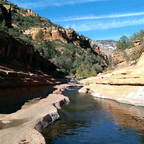 Slide rock state park photos - Natural Water Slide. Slide Rock is 80 feet long and 2.5 to 4 feet wide, with a seven percent decline from top to bottom. Algae on the rocks creates a very slippery ride. The entire swimming area is nearly 1/2 mile long, but most of the attention is …